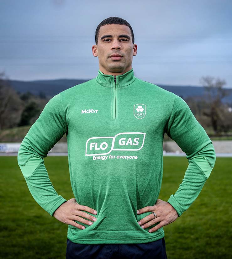 Jordan Conroy, Irish Olympic rugby sports star, stands in Flogas branded top